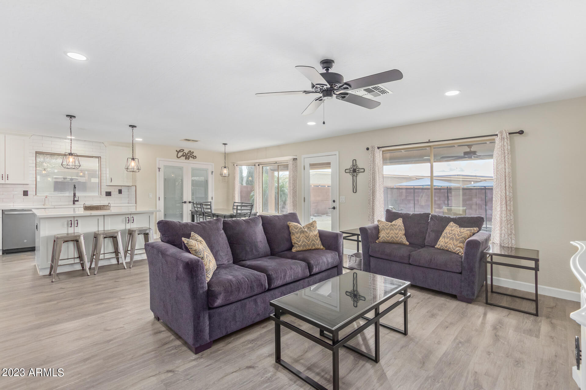 2561 West Tanner Ranch Road Queen Creek, AZ 85144 - Photo 14 of 36 a living room with furniture and a view of kitchen