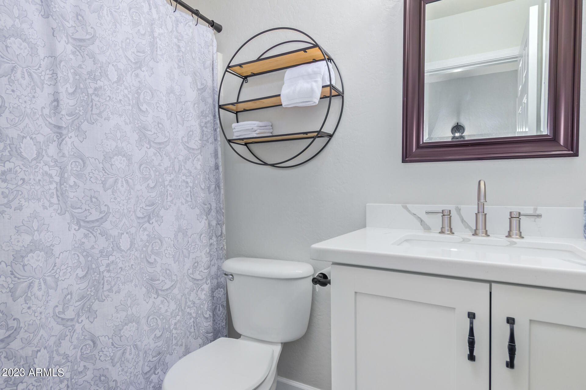 2561 West Tanner Ranch Road Queen Creek, AZ 85144 - Photo 15 of 36 a bathroom with a toilet sink and mirror