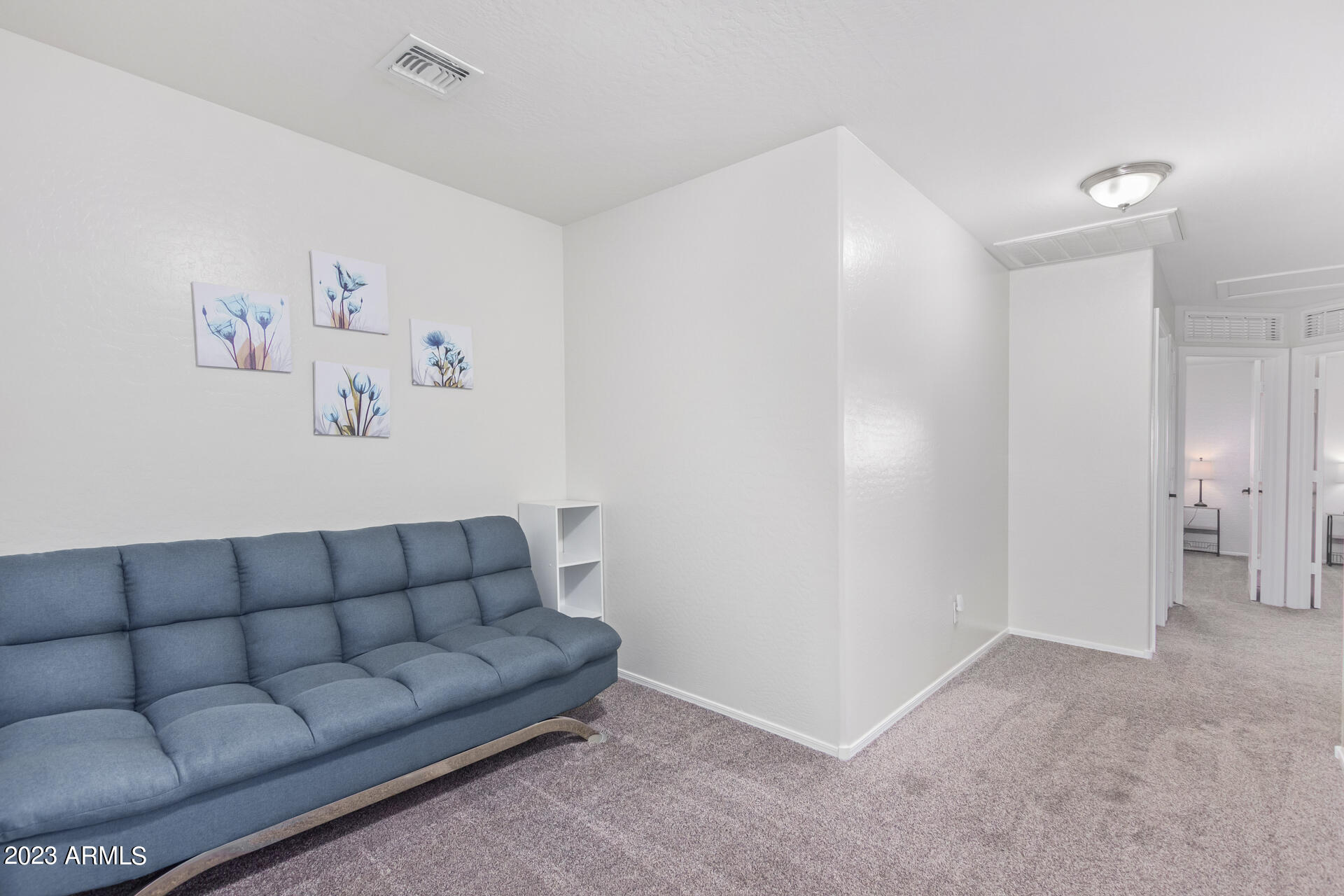 2561 West Tanner Ranch Road Queen Creek, AZ 85144 - Photo 17 of 36 a living room with furniture and white walls