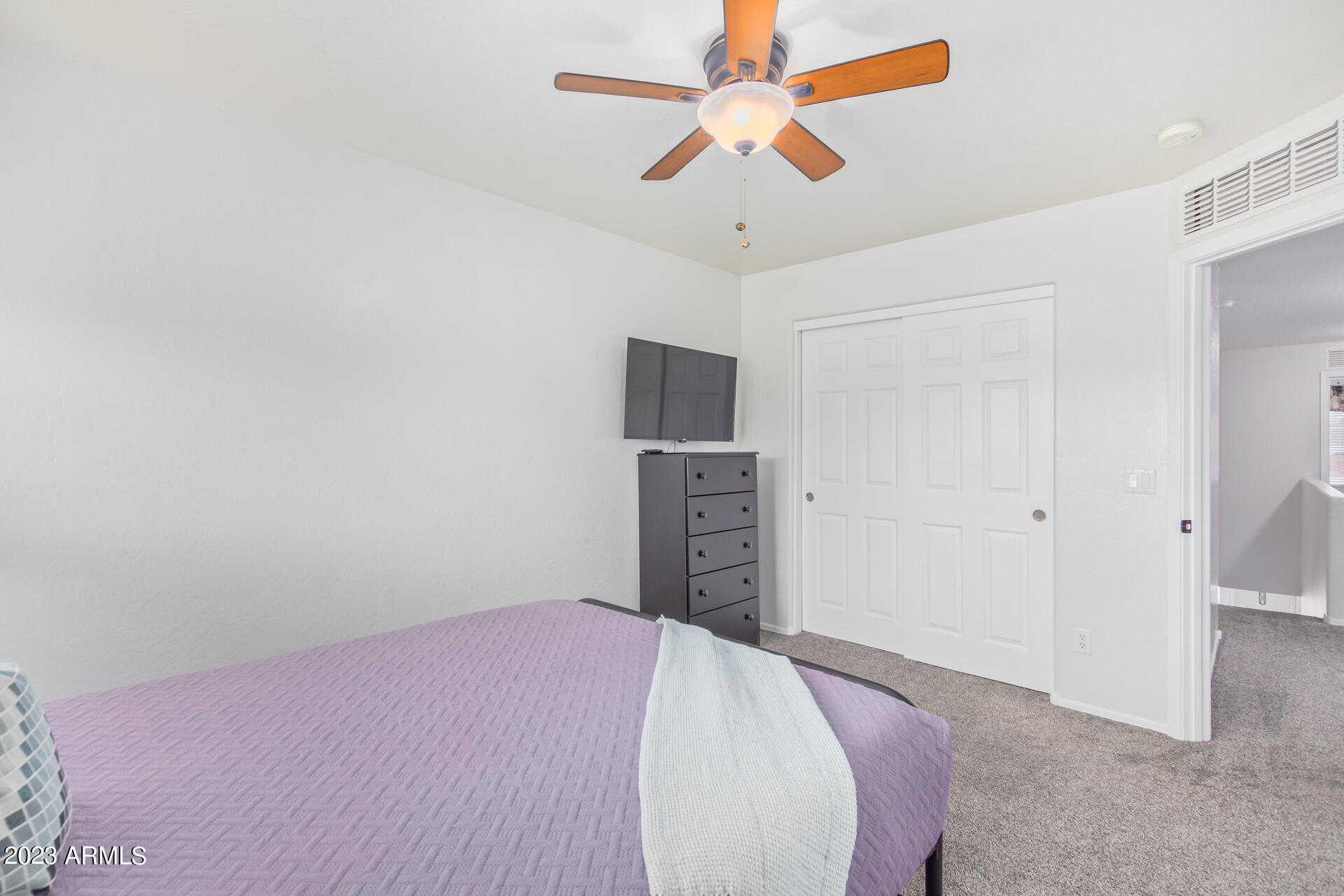 2561 West Tanner Ranch Road Queen Creek, AZ 85144 - Photo 26 of 36 a bedroom with a bed and a flat screen tv