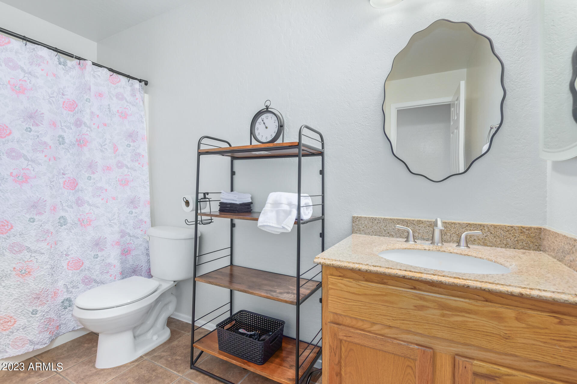 2561 West Tanner Ranch Road Queen Creek, AZ 85144 - Photo 29 of 36 a bathroom with a toilet sink and mirror