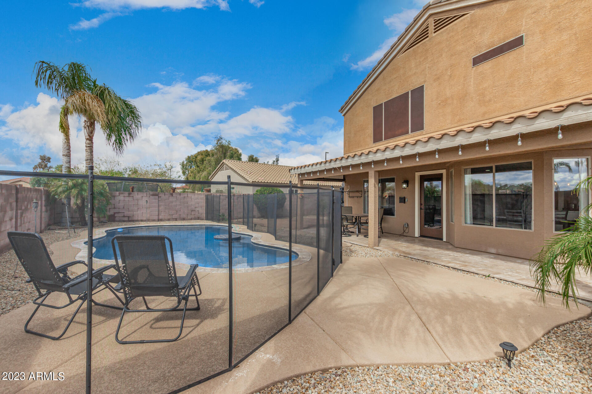 2561 West Tanner Ranch Road Queen Creek, AZ 85144 - Photo 33 of 36 a view of a chairs and table in patio