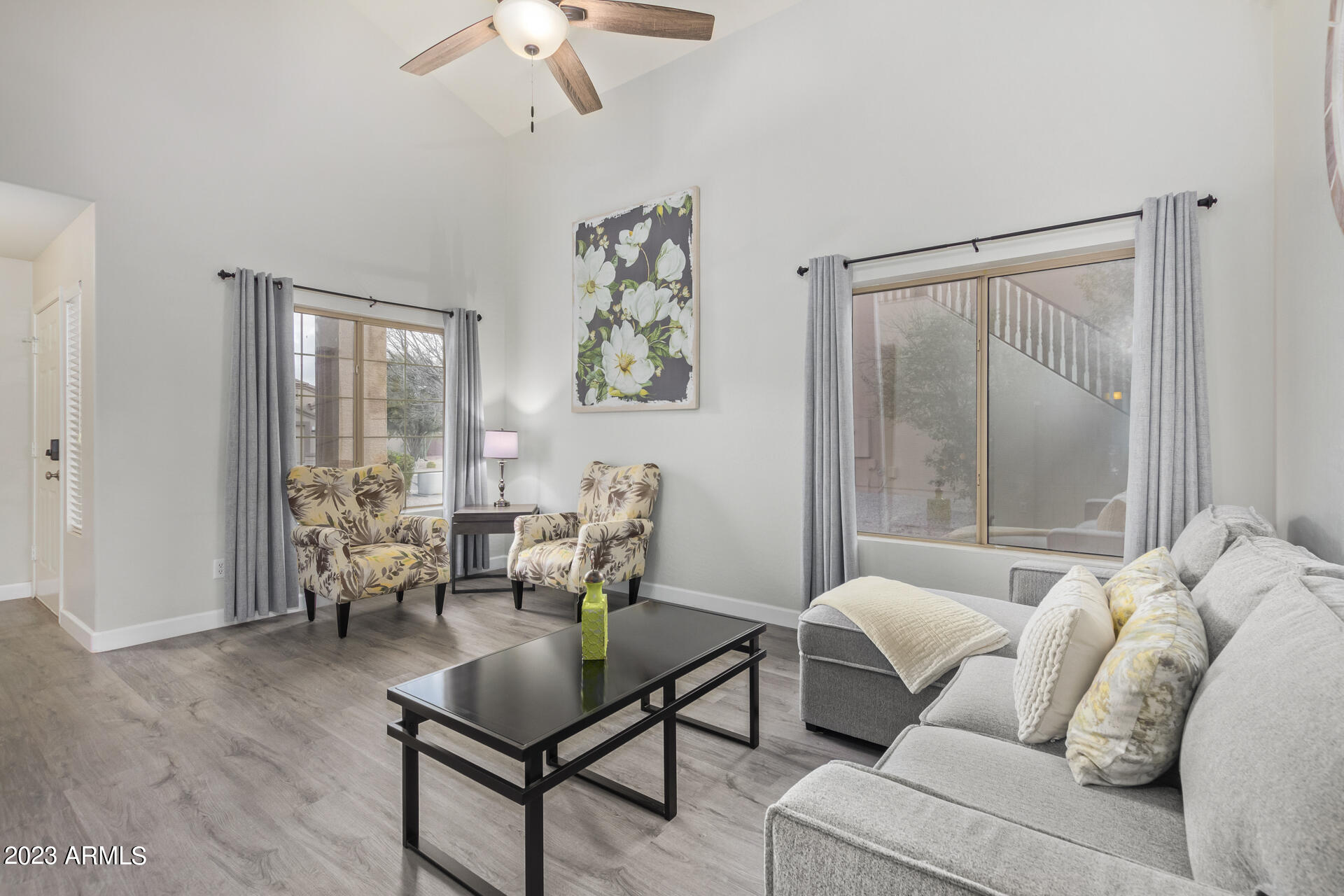 2561 West Tanner Ranch Road Queen Creek, AZ 85144 - Photo 5 of 36 a living room with furniture and a window