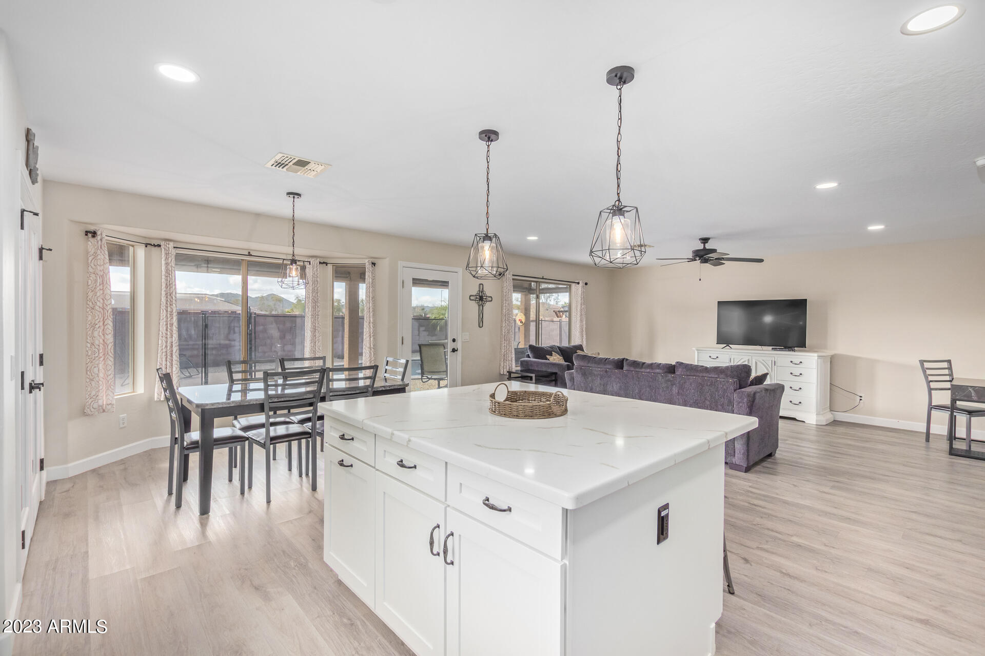 2561 West Tanner Ranch Road Queen Creek, AZ 85144 - Photo 10 of 36 a view of dining table chairs and wooden floor