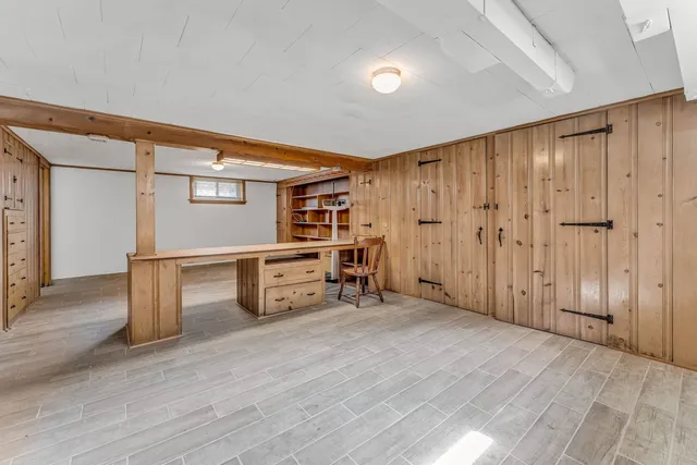 a view of a room with wooden shelves