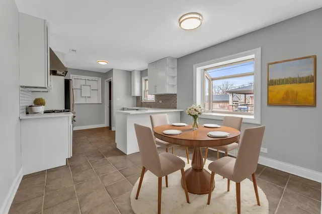 a dining room with furniture and window