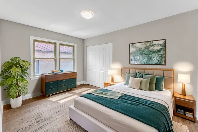 a bedroom with a bed and a window