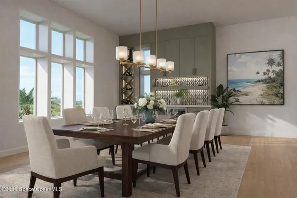 a dining room with furniture a chandelier and wooden floor