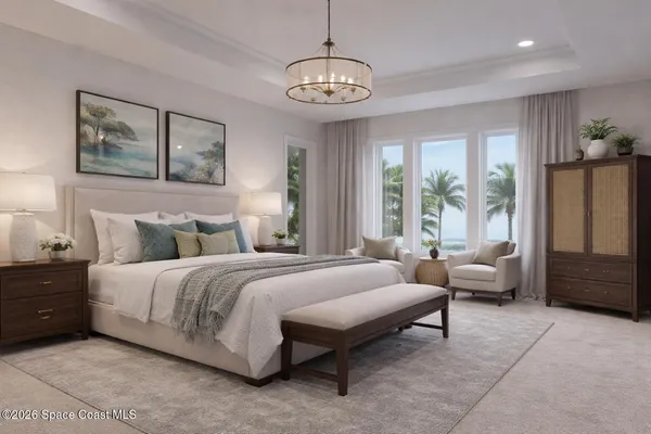 a spacious bedroom with a bed a couch and a window