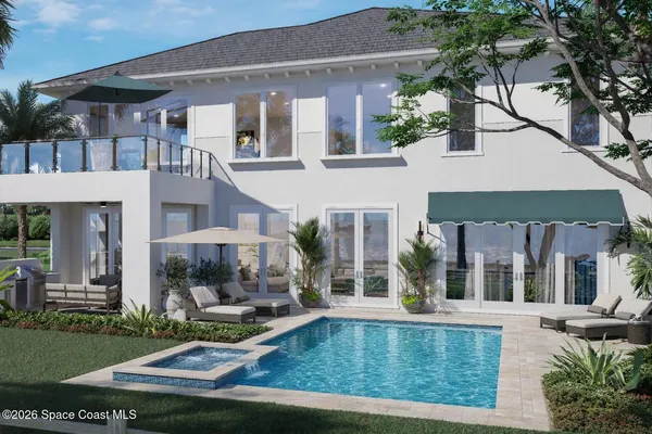 a view of a house with sitting area and swimming pool