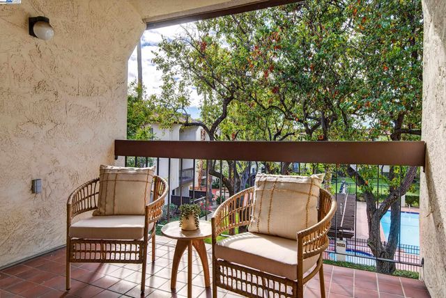 a view of balcony with furniture