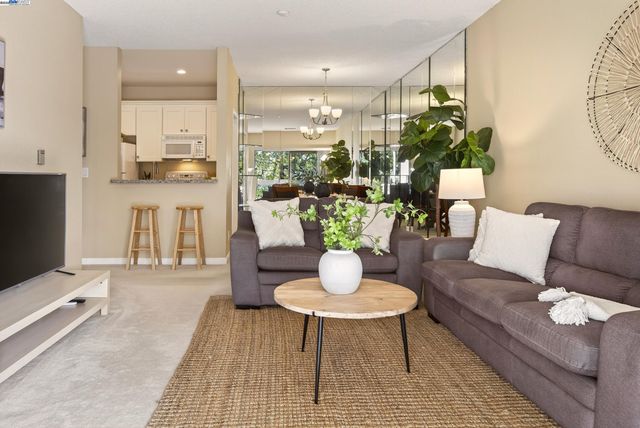 a living room with furniture and a table
