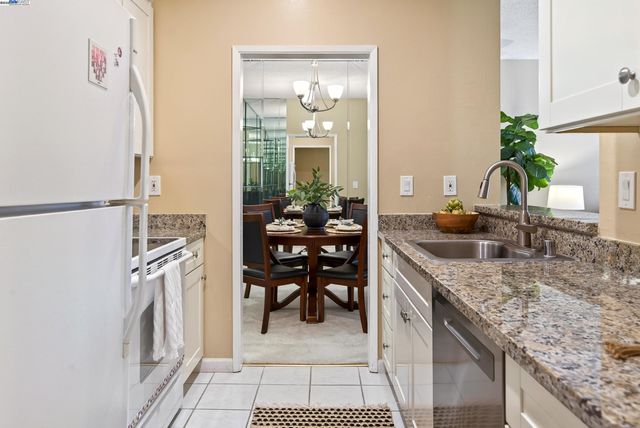 a kitchen with a table and chairs in it