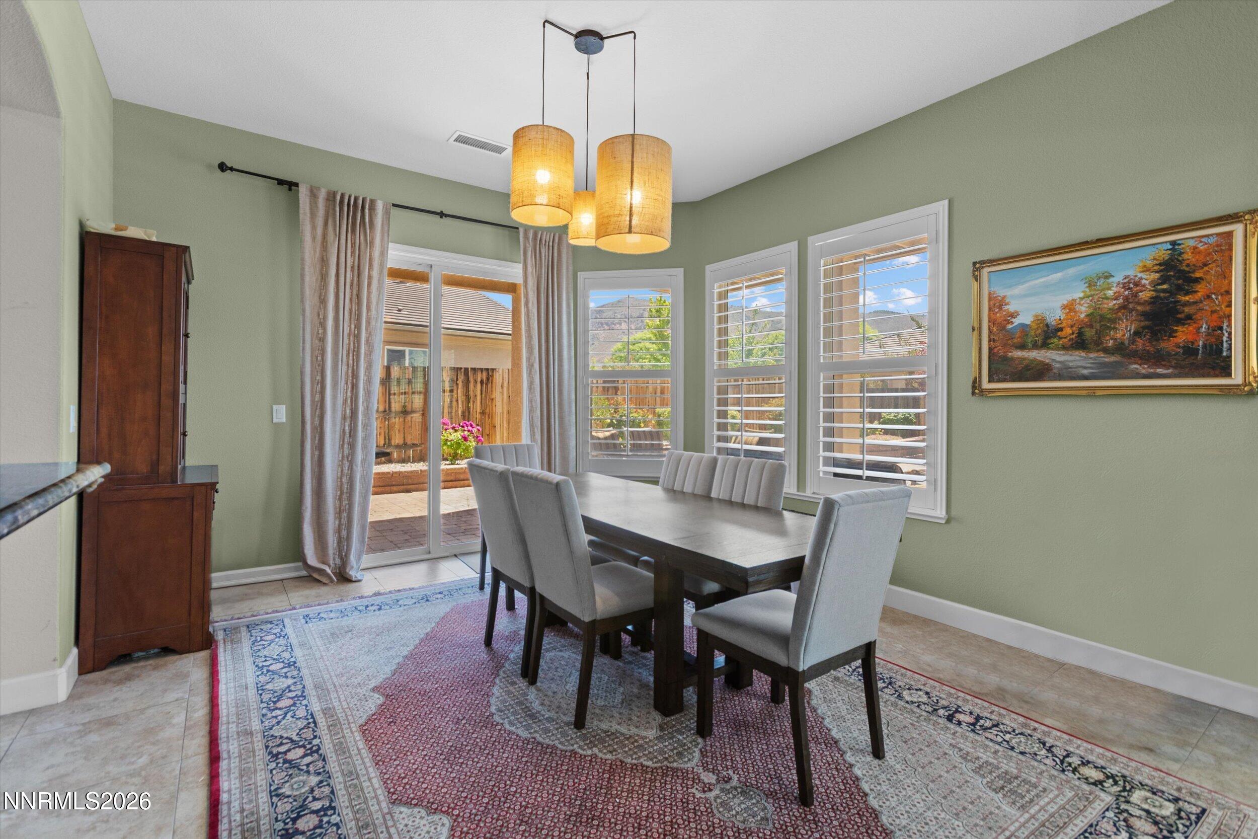 2920 Bull Rider Drive Reno, NV 89521 - Photo 15 of 51 a view of a dining room with furniture window and wooden floor