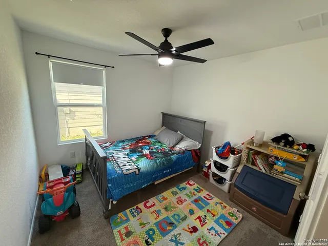 a bed room with furniture and a window