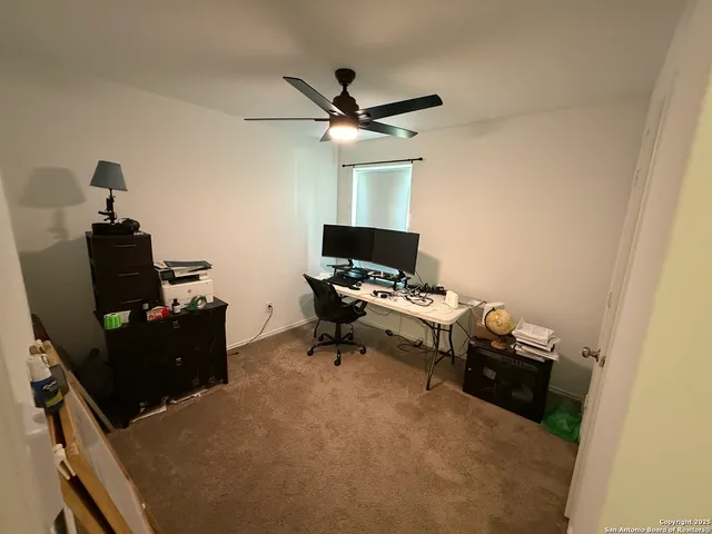 a bedroom with a workspace