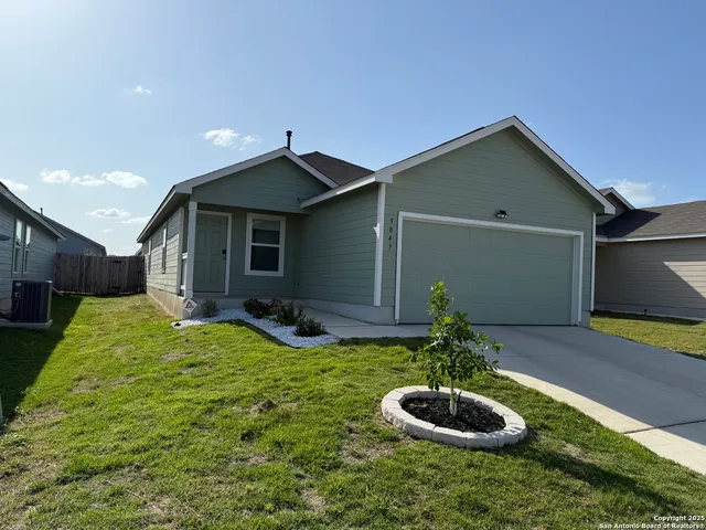 a backyard of a house with yard fire pit and outdoor seating