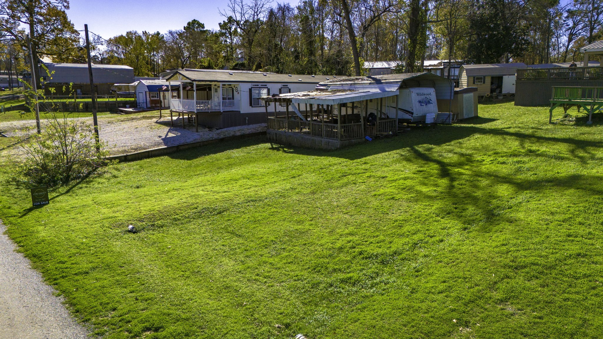 240 Key Largo Loop Point Blank, TX 77364 - Photo 2 of 12 a view of a house with a yard patio and swimming pool
