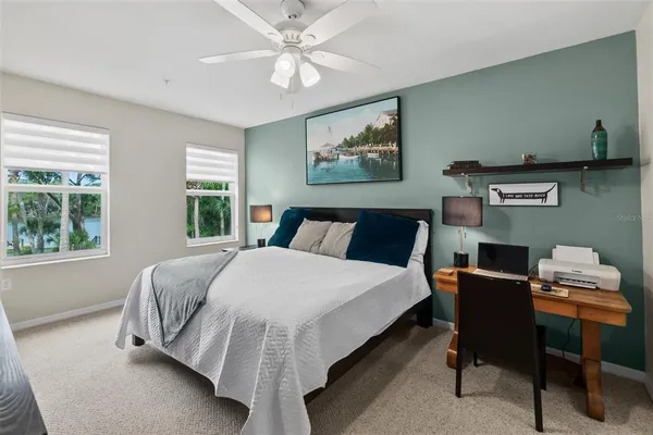 a bedroom with a bed and a table
