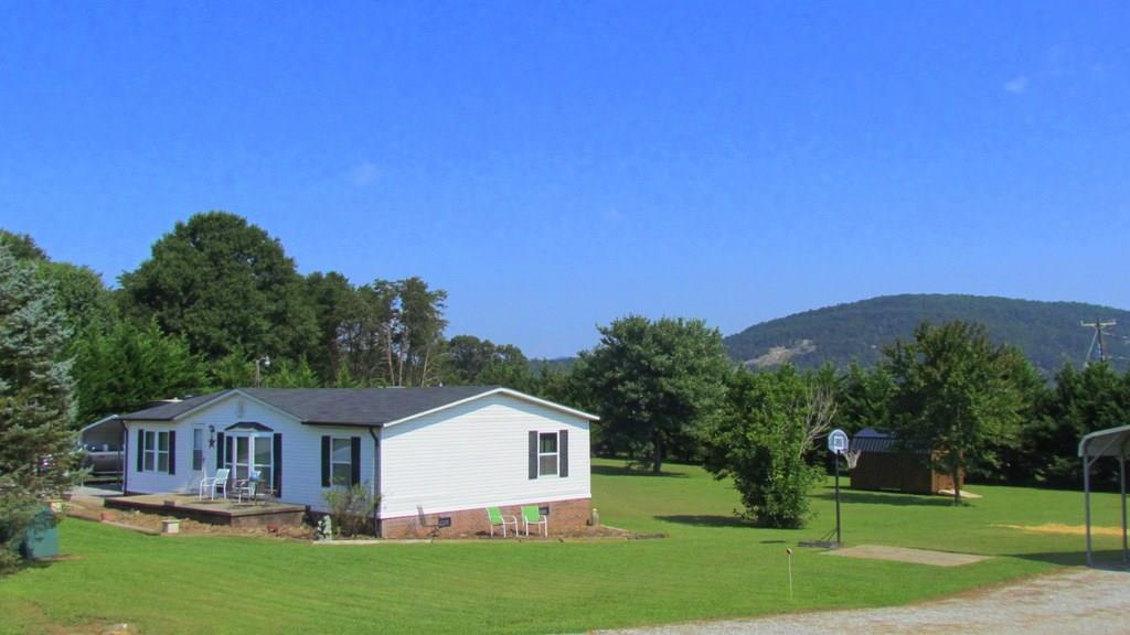 1317 Poole Gooden Road Hiddenite, NC 28636 - Photo 1 of 36 a front view of a house with a yard
