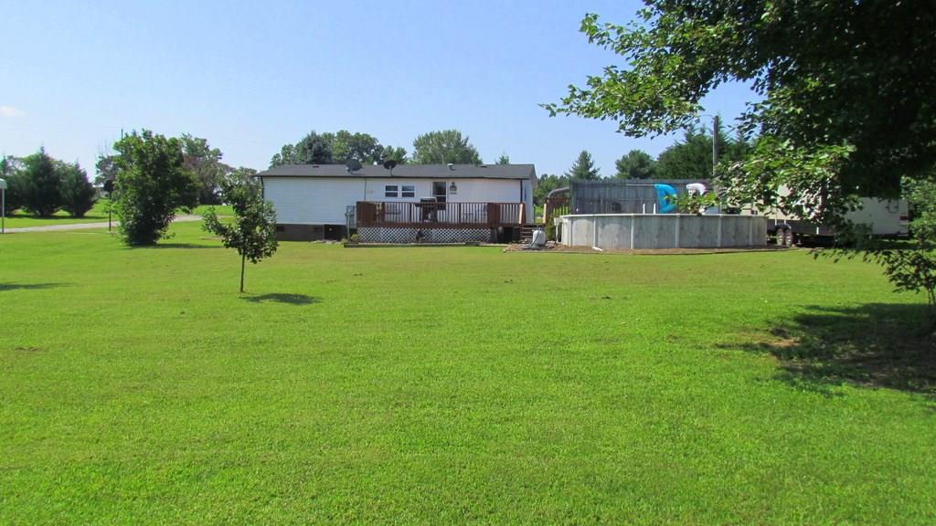 1317 Poole Gooden Road Hiddenite, NC 28636 - Photo 11 of 36 a view of a house with a backyard