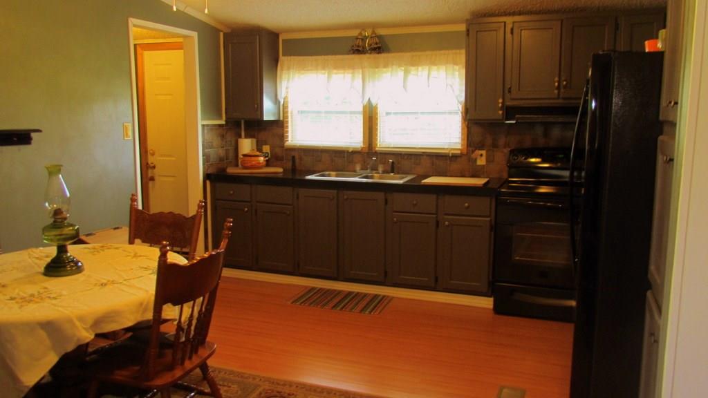 1317 Poole Gooden Road Hiddenite, NC 28636 - Photo 18 of 36 a bathroom with a sink and a window