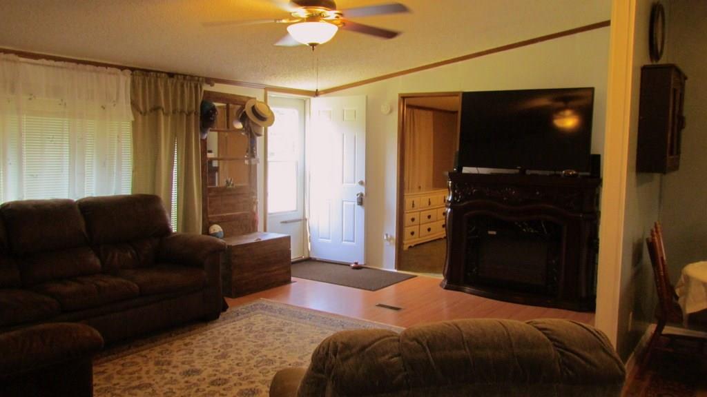 1317 Poole Gooden Road Hiddenite, NC 28636 - Photo 19 of 36 a bedroom with a bed and a television