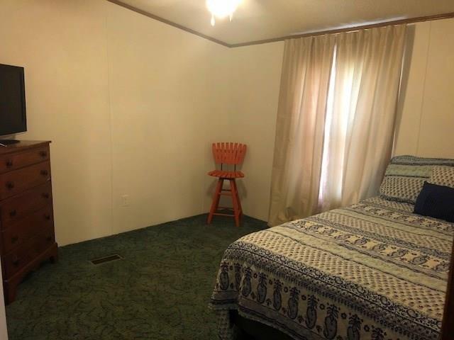 1317 Poole Gooden Road Hiddenite, NC 28636 - Photo 22 of 36 a bedroom with a bed and a window