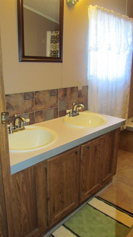 1317 Poole Gooden Road Hiddenite, NC 28636 - Photo 24 of 36 a bathroom with a sink and a bathtub