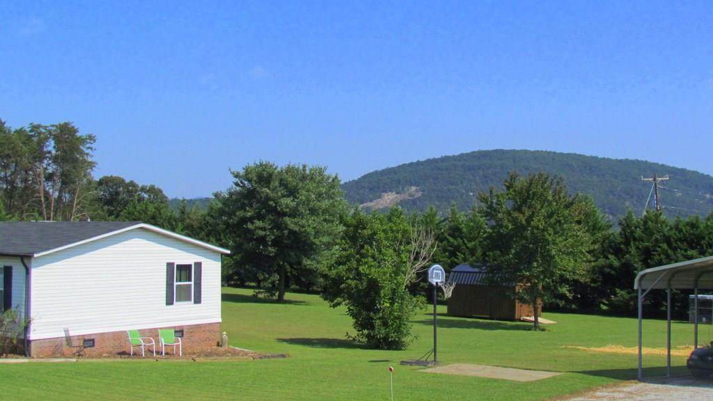 1317 Poole Gooden Road Hiddenite, NC 28636 - Photo 4 of 36 a front view of a house with a yard