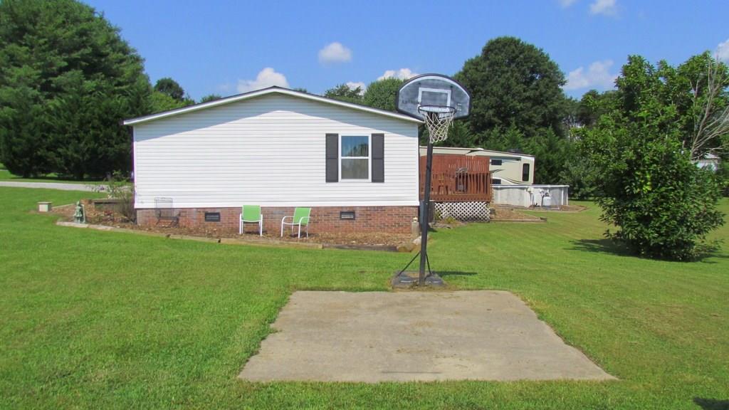1317 Poole Gooden Road Hiddenite, NC 28636 - Photo 33 of 36 a view of a house with backyard and garden