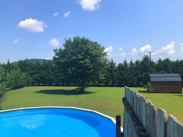 1317 Poole Gooden Road Hiddenite, NC 28636 - Photo 5 of 36 a view of a golf course with a lake
