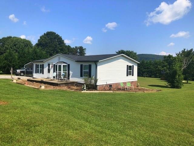1317 Poole Gooden Road Hiddenite, NC 28636 - Photo 7 of 36 a view of a house with a big yard