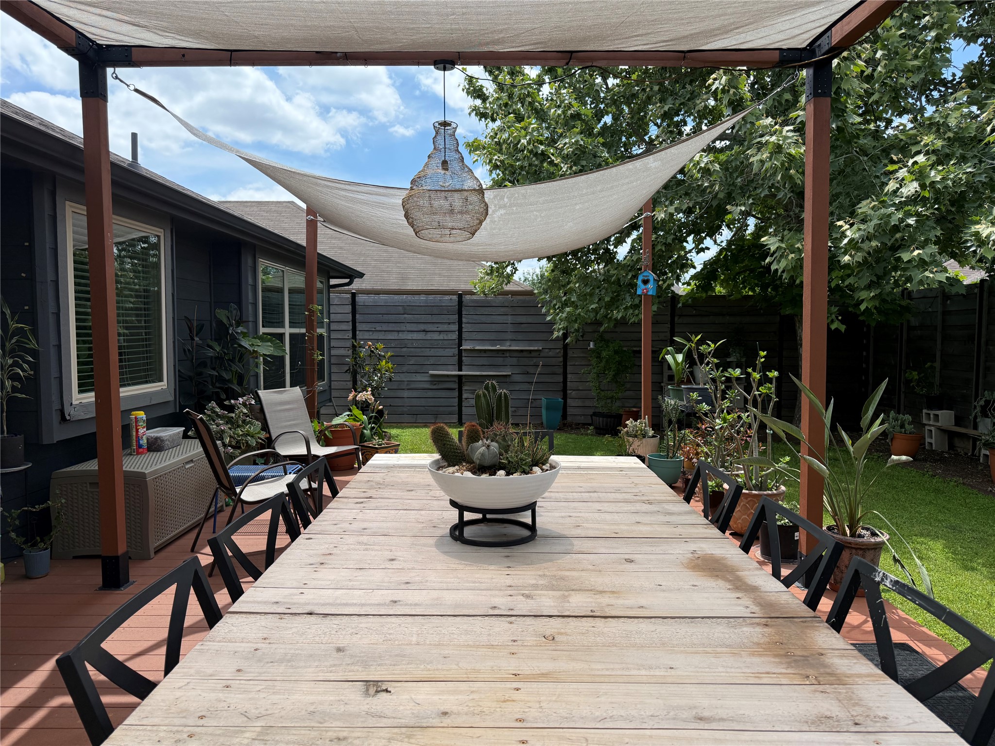 7108 Hester Road Austin, TX 78725 - Photo 16 of 25 a view of a patio with couches table and chairs and potted plants
