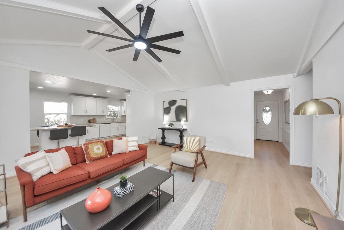 10719 Burgoyne Road Houston, TX 77042 - Photo 12 of 36 The family room is generously sized, with a vaulted ceiling that enhances the sense of space. It’s a versatile area with room for additional seating, a workspace, or even a play area to keep the kids nearby.