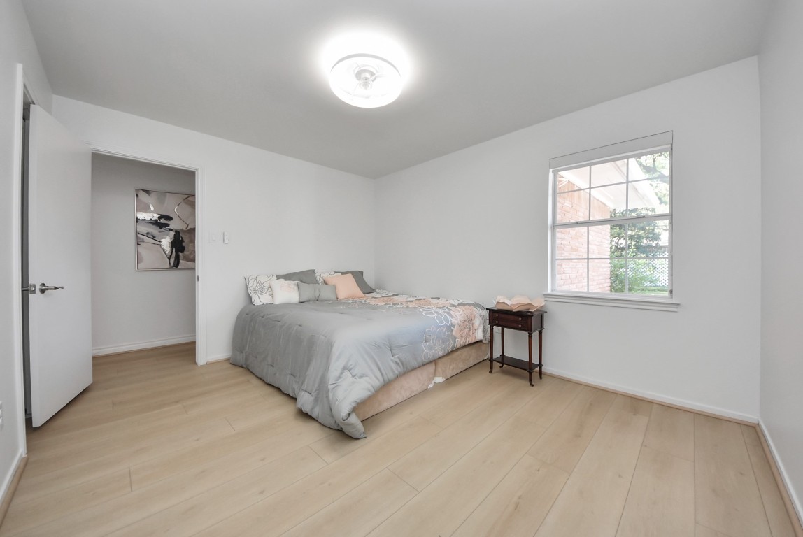 10719 Burgoyne Road Houston, TX 77042 - Photo 20 of 36 Bedroom #4 faces the backyard and offers a spacious layout, along with double closets for added storage.