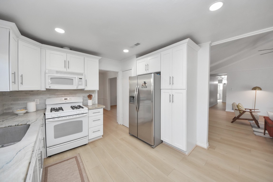 10719 Burgoyne Road Houston, TX 77042 - Photo 10 of 36 You’ll find plenty of storage, along with a convenient pantry area next to the fridge. The kitchen was remodeled in 2023.