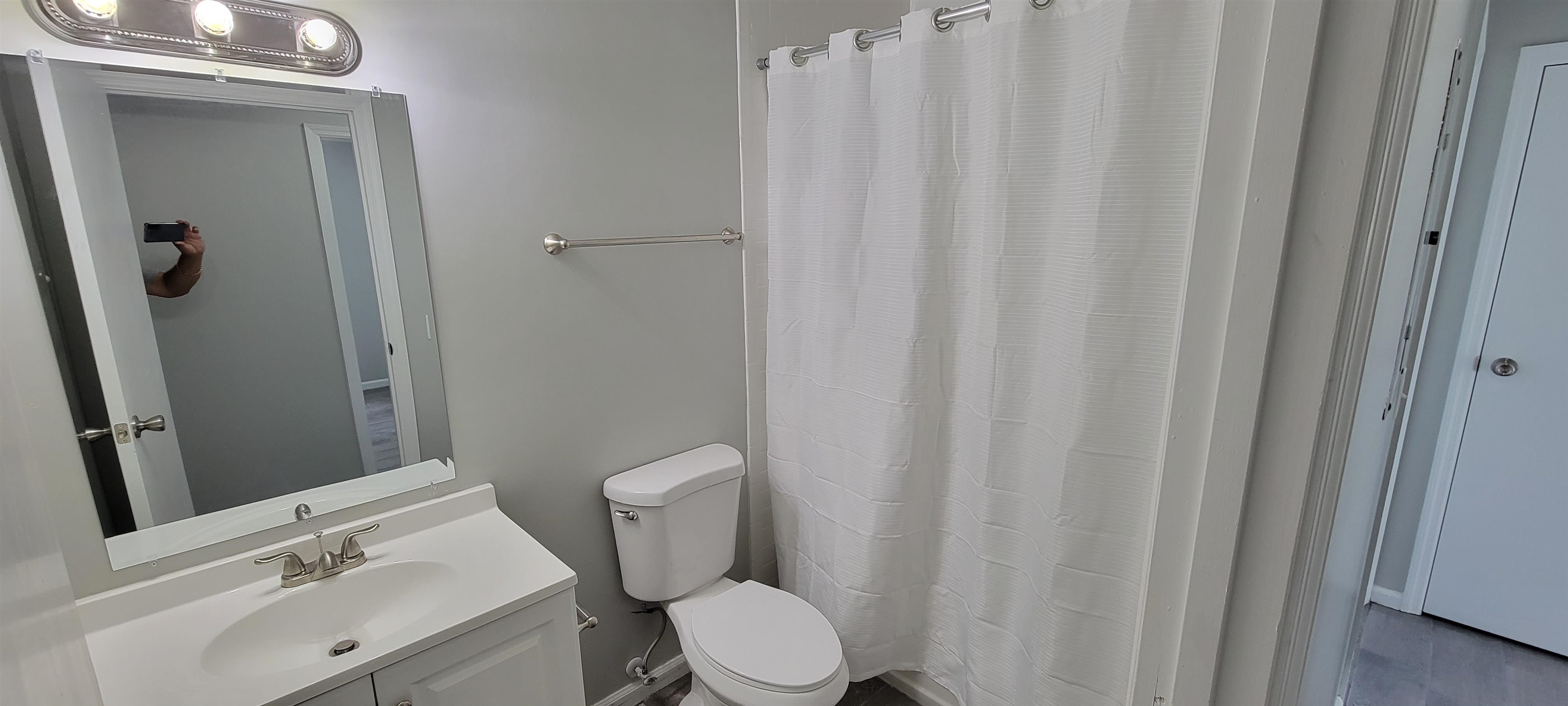 3 Travis Lane St. Augustine, FL 32084 - Photo 11 of 27 a bathroom with a sink a toilet and shower curtain