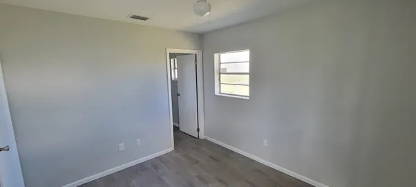 an empty room with windows