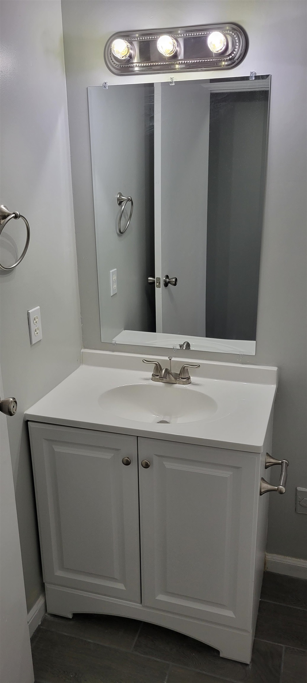 3 Travis Lane St. Augustine, FL 32084 - Photo 18 of 27 a bathroom with a sink and a mirror