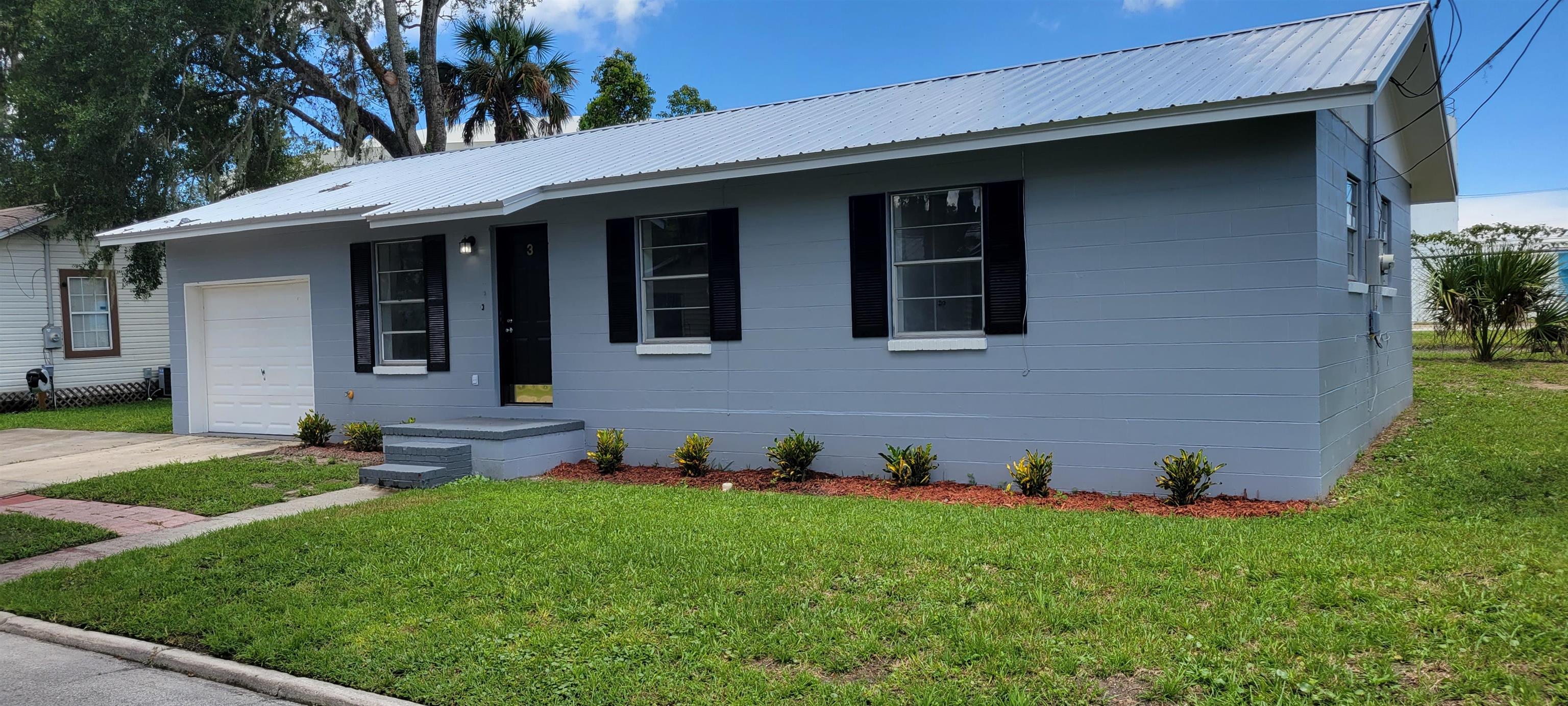 3 Travis Lane St. Augustine, FL 32084 - Photo 2 of 27 a front view of a house with a yard