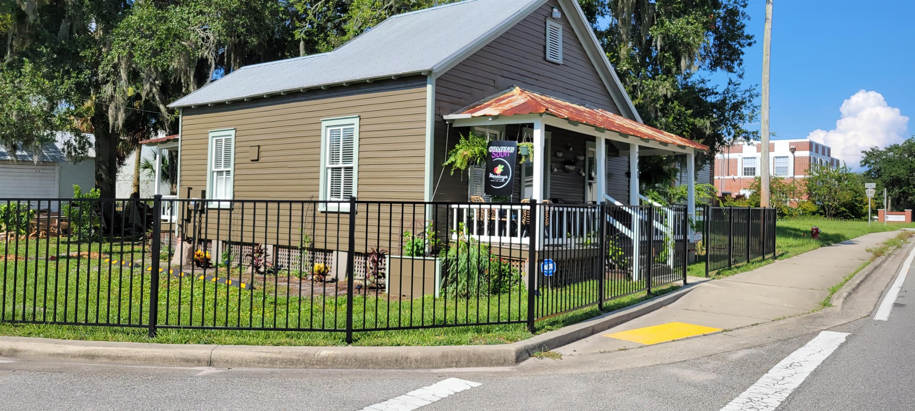 3 Travis Lane St. Augustine, FL 32084 - Photo 21 of 27 a view of a house with a backyard and a garden