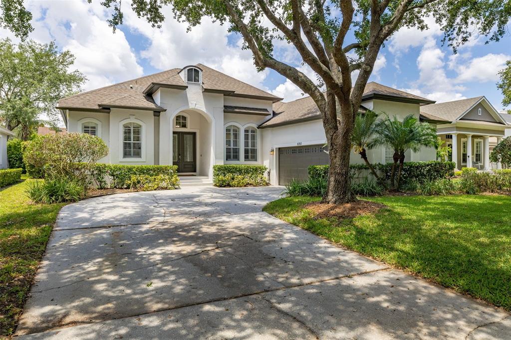 8351 Bowden Way Windermere, FL 34786 - Photo 1 of 71 a front view of a house with garden