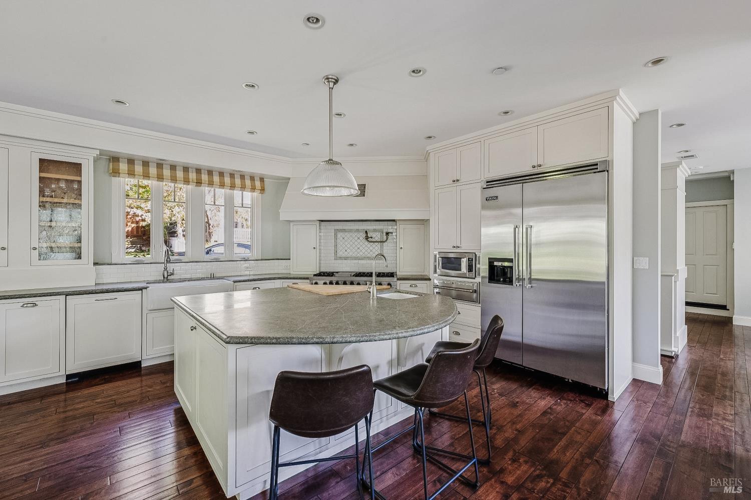529 Alta Way Mill Valley, CA 94941 - Photo 15 of 58 a kitchen with a table chairs refrigerator and window