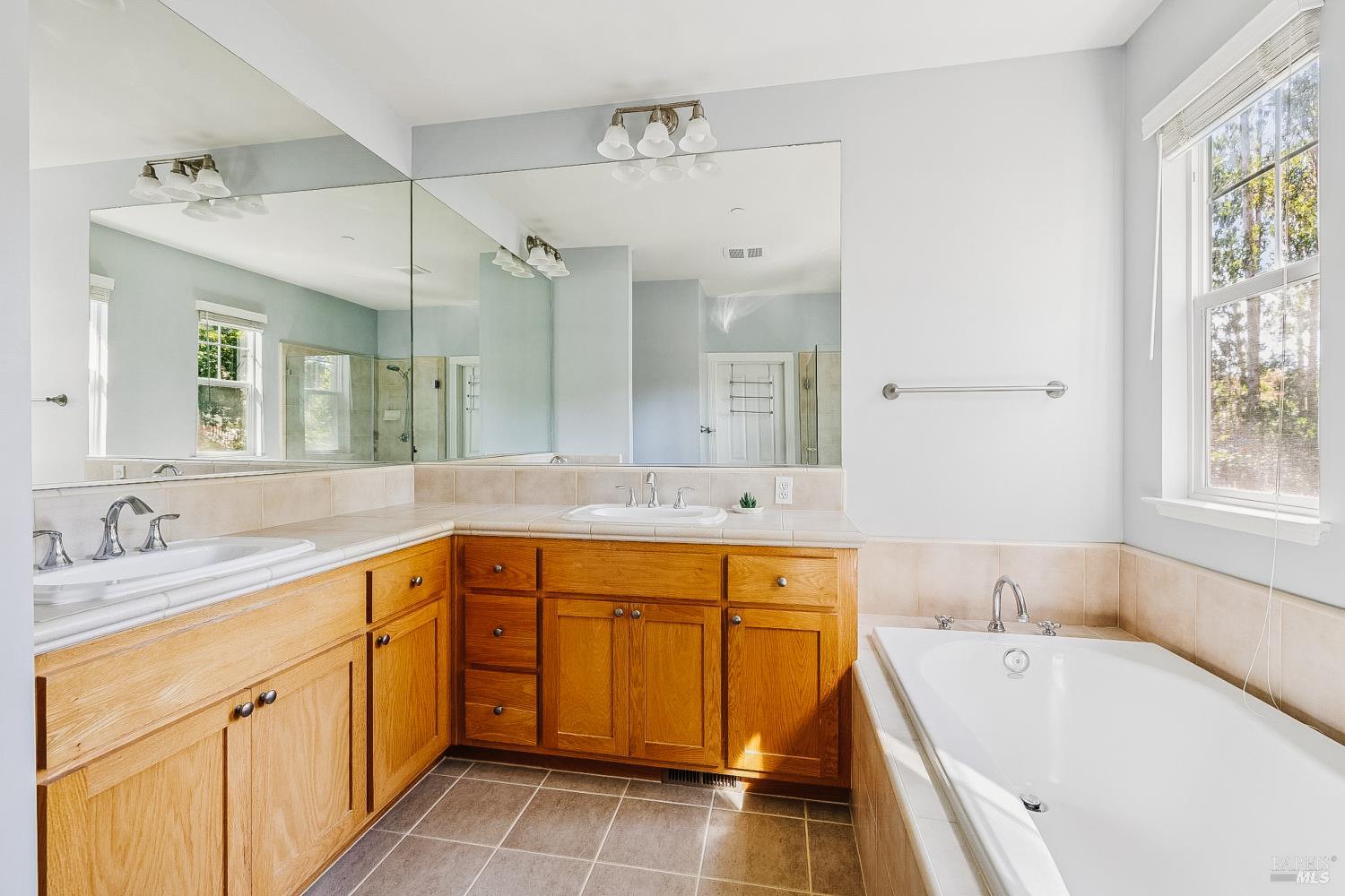 529 Alta Way Mill Valley, CA 94941 - Photo 30 of 58 a spacious bathroom with a tub sink and mirror