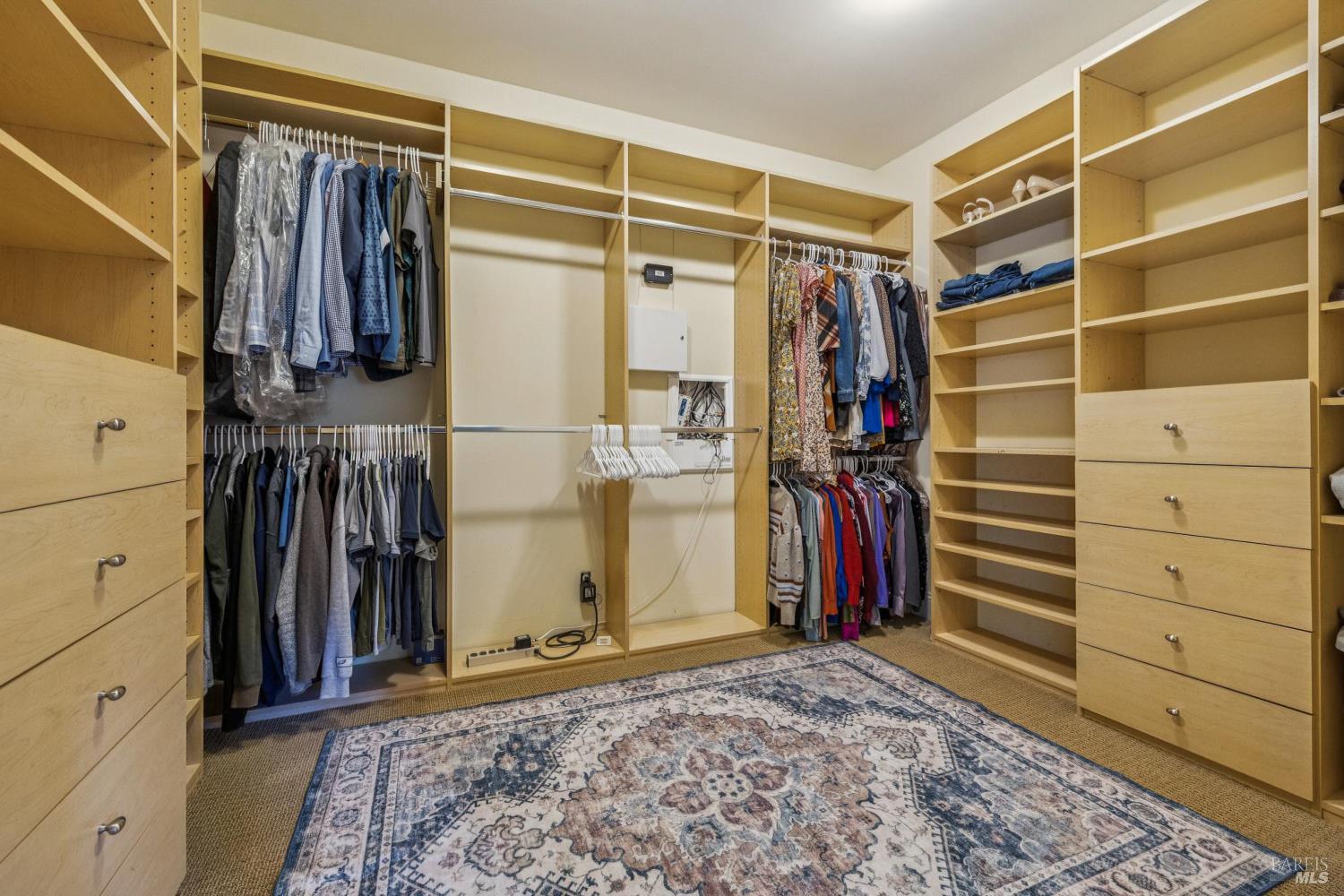 529 Alta Way Mill Valley, CA 94941 - Photo 32 of 58 a view of walk in closet with clothes and shoes
