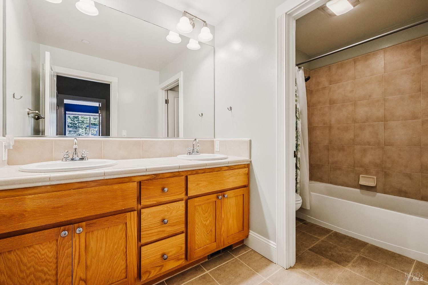 529 Alta Way Mill Valley, CA 94941 - Photo 40 of 58 a bathroom with a tub sink and mirror