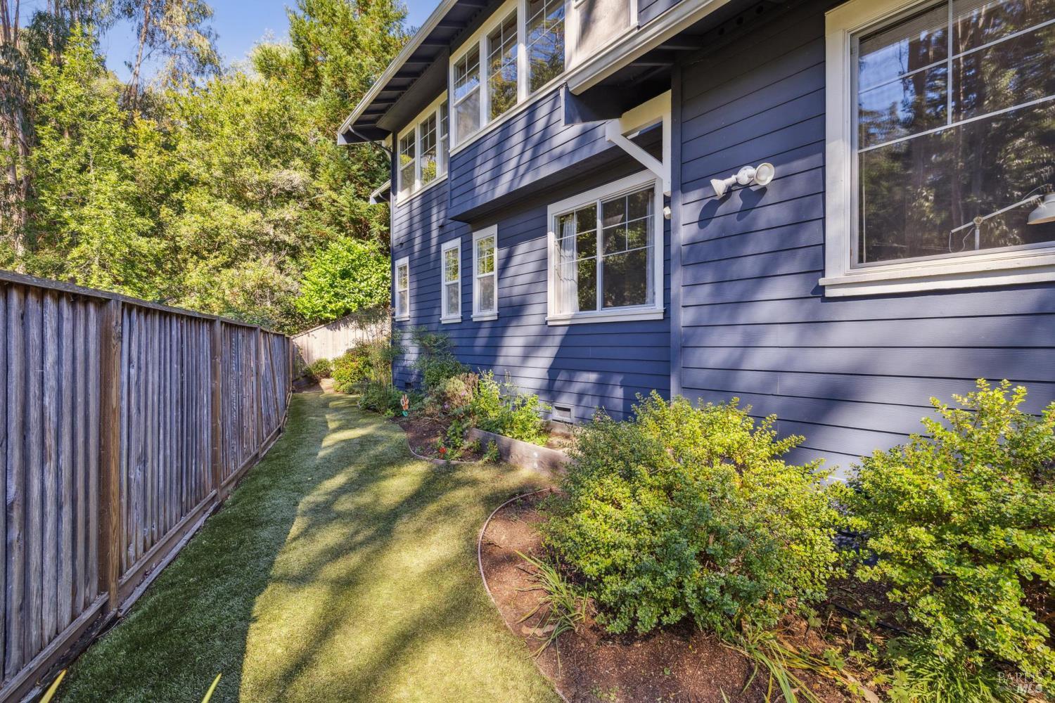 529 Alta Way Mill Valley, CA 94941 - Photo 44 of 58 a view of a brick house with a yard and potted plants