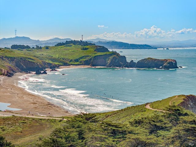 a city street lined with buildings and cars