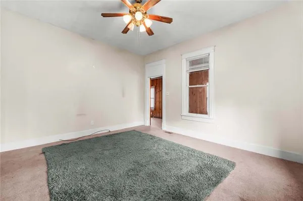 a view of a kitchen with a stove cabinets and a wooden floor